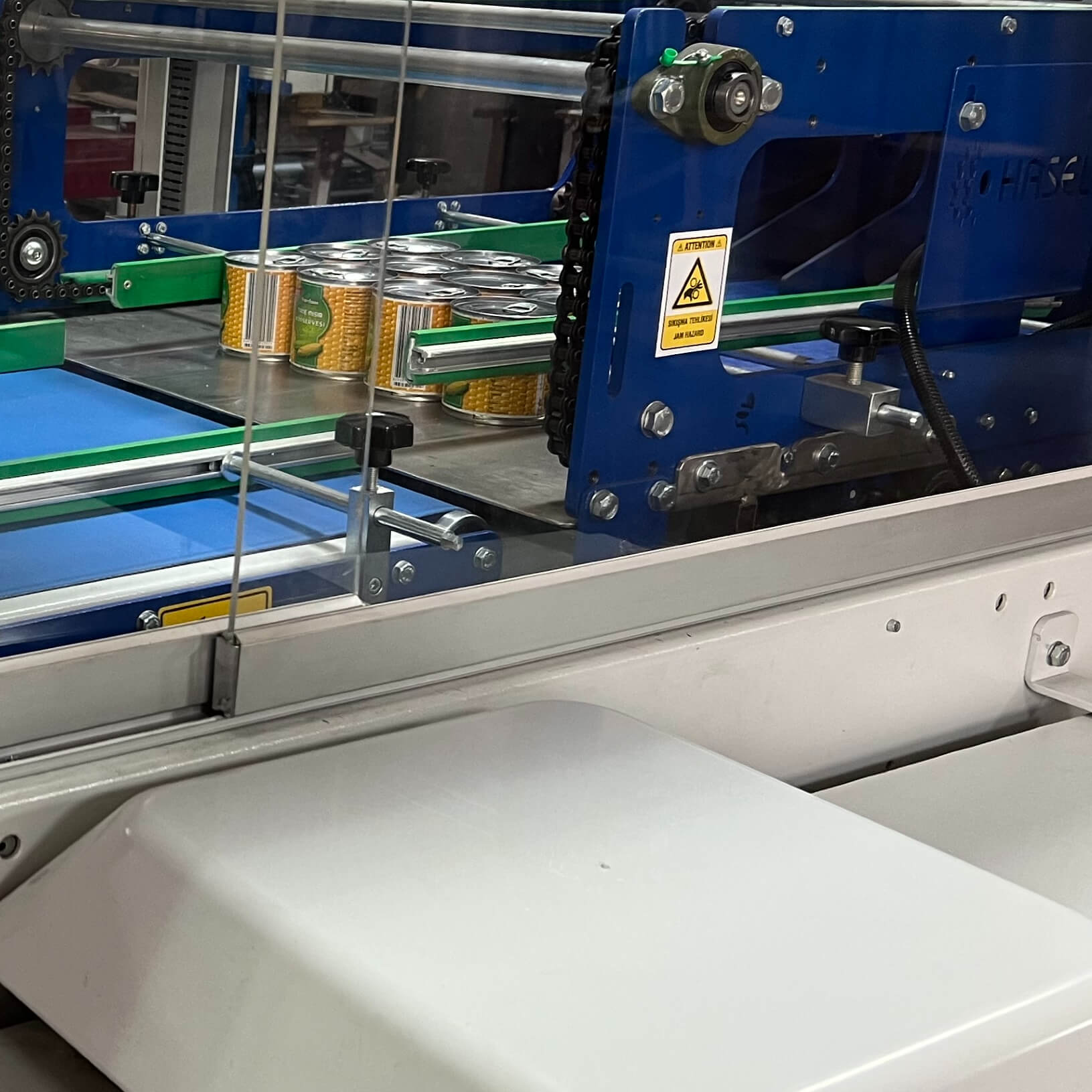 ERC Cardboard Feeding Automatic Shrink Packaging - Areté Group Packaging Machinery and Conveyor Solutions