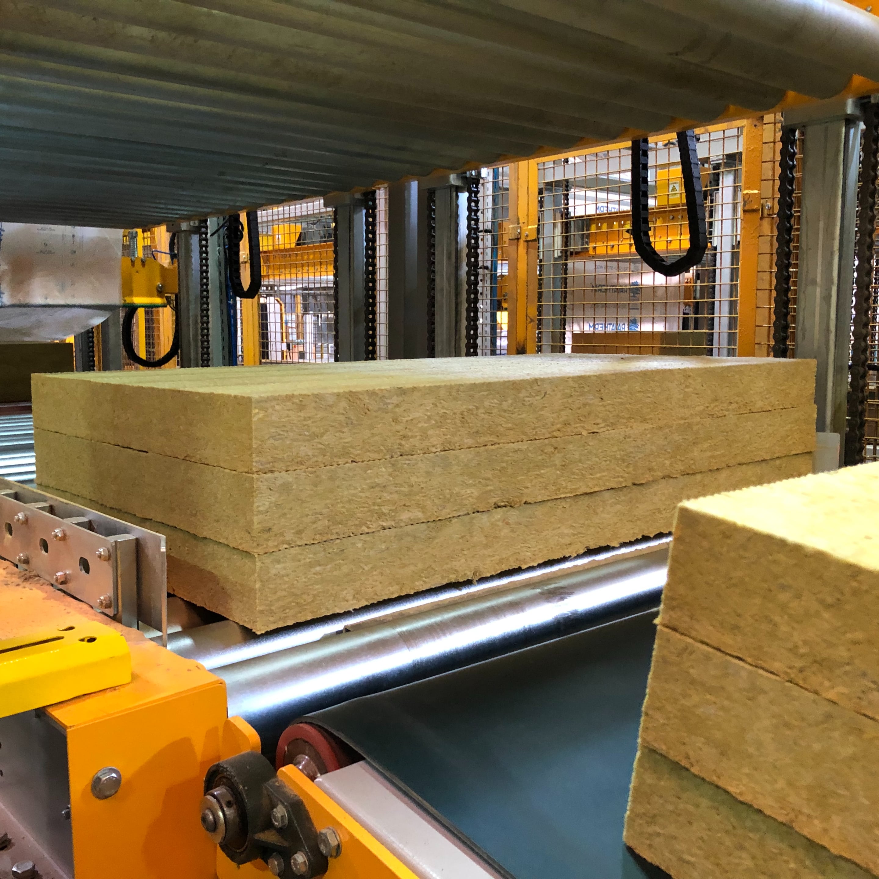 ERW Rock and Glass Wool Shrink Packaging - Areté Group Packaging Machinery and Conveyor Solutions