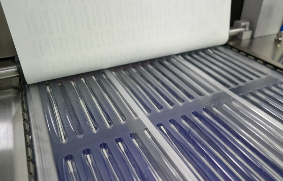 SMD Medical Disposable Supply Thermoform Sealer - Areté Group Packaging Machinery and Conveyor Solutions