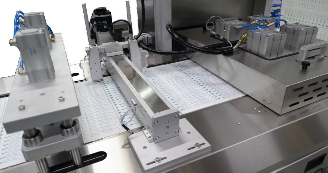 SMD Medical Disposable Supply Thermoform Sealer - Areté Group Packaging Machinery and Conveyor Solutions