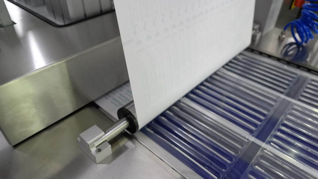 SMD Medical Disposable Supply Thermoform Sealer - Areté Group Packaging Machinery and Conveyor Solutions