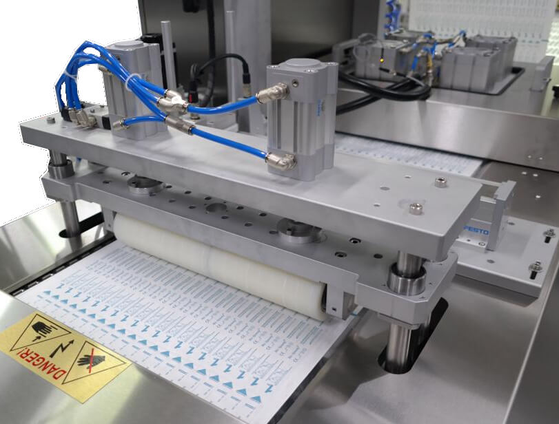 SMD Medical Disposable Supply Thermoform Sealer - Areté Group Packaging Machinery and Conveyor Solutions